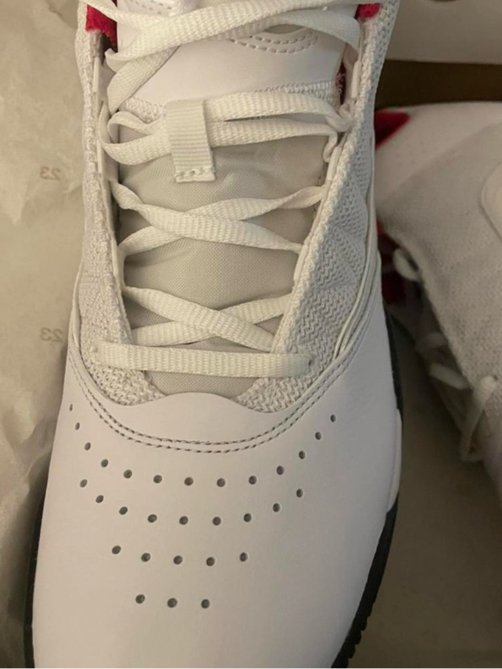 Jordan Women’s White Sneakers with Red Accents